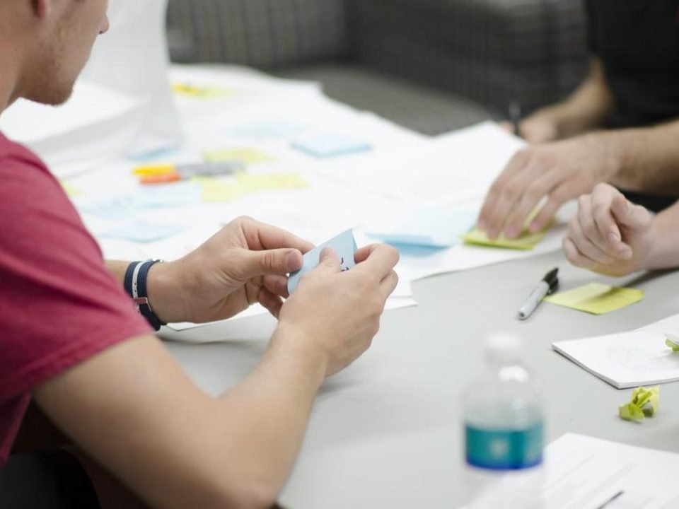 A team planning with sticky notes at a table
