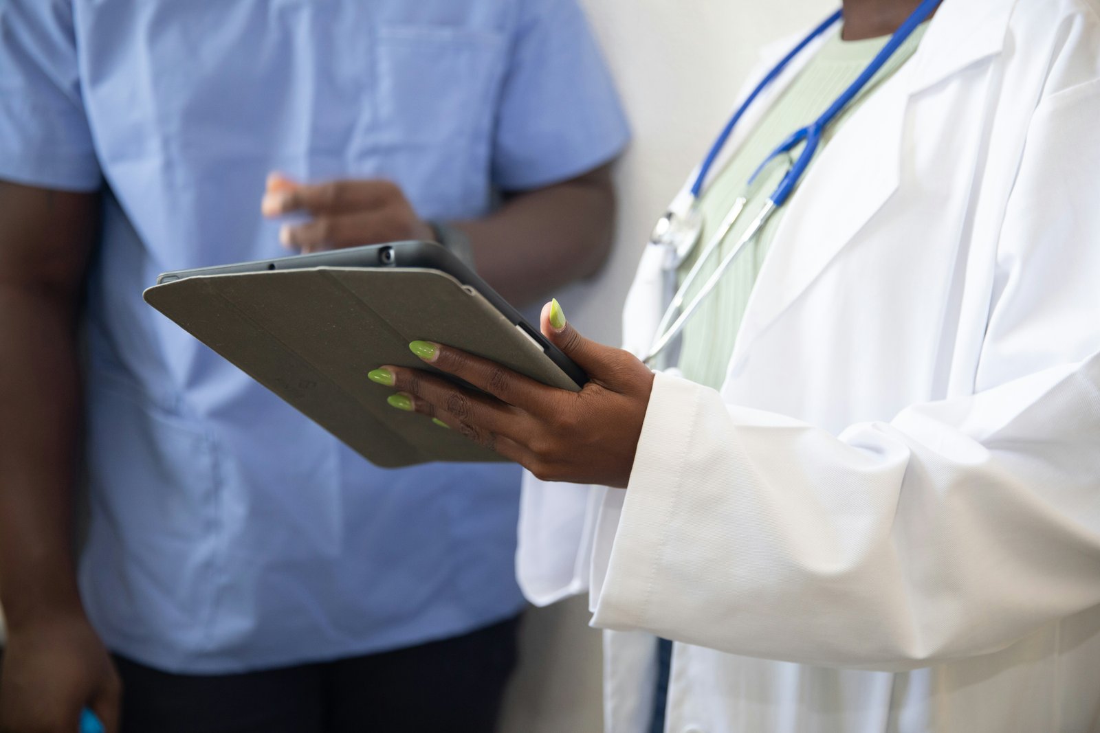 Doctor reviewing consultation context on a tablet
